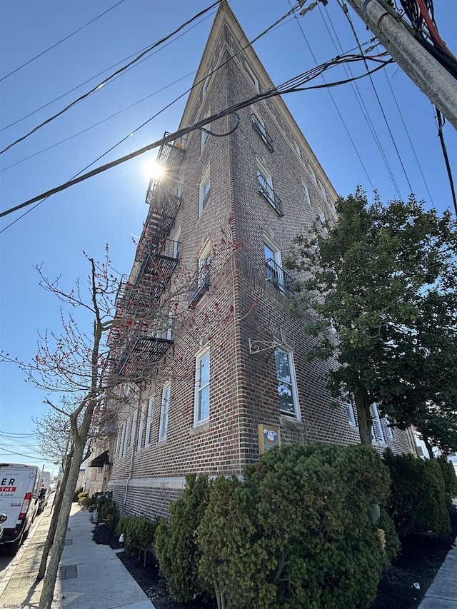view of side of property with brick siding