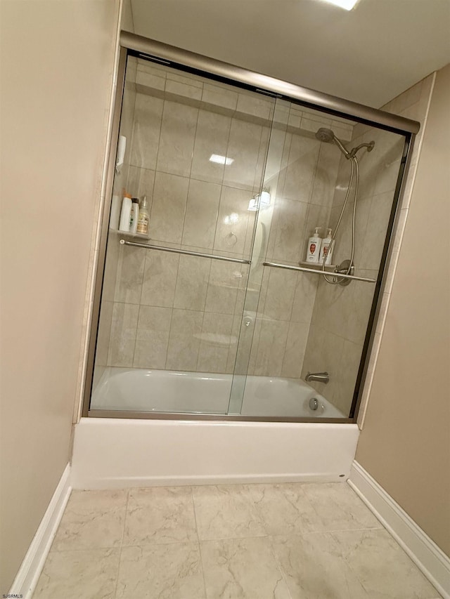 336 Bay Ave Unit 605, Ocean City, NJ 08226 - bathroom featuring baseboards, combined bath / shower with glass door, and marble finish floor