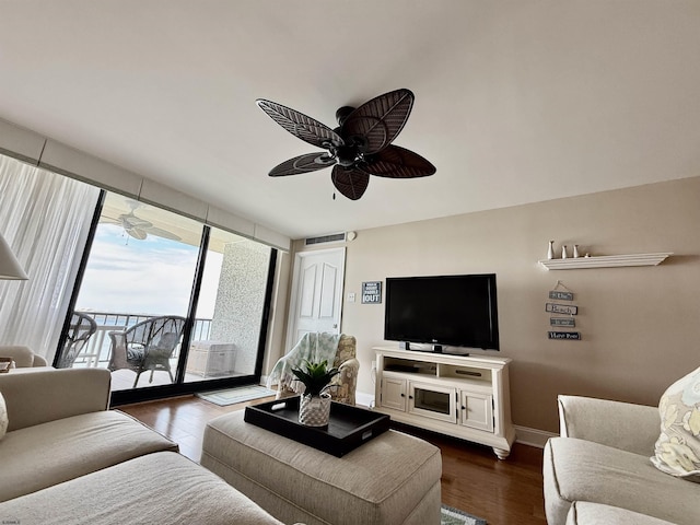 336 Bay Ave Unit 605, Ocean City, NJ 08226 - living room with expansive windows, a ceiling fan, dark wood finished floors, baseboards, and visible vents