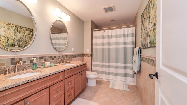 1905 Glenwood Dr, Ocean City, NJ 08226 - bathroom featuring tile patterned flooring, tile walls, a sink, and visible vents