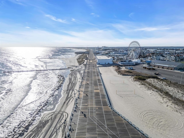 bird's eye view featuring a water view and a view of the beach
