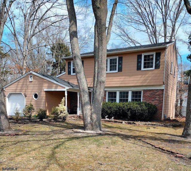 714 Blenheim Ave, Absecon, NJ 08201 - view of front of property with a front yard, a garage, and brick siding