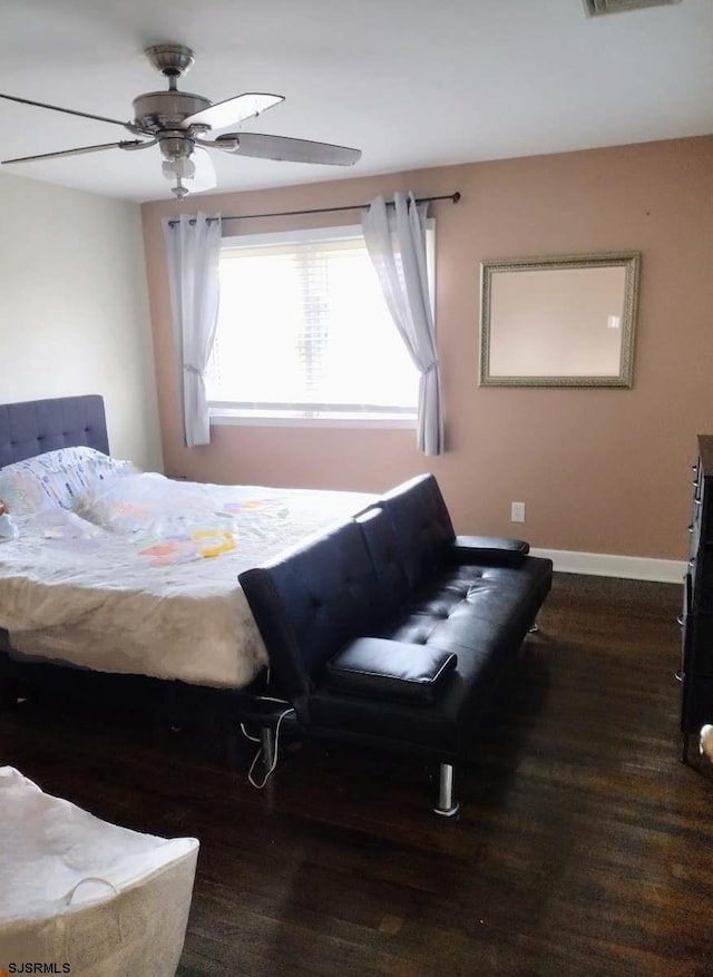 714 Blenheim Ave, Absecon, NJ 08201 - bedroom with baseboards, visible vents, wood finished floors, and a ceiling fan