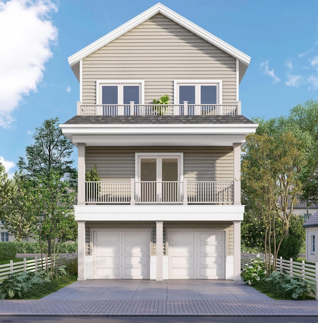 1651 W Ave, Ocean City, NJ 08226 - view of front of house with concrete driveway, fence, a garage, and a balcony