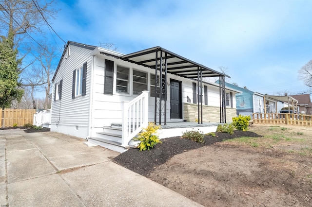 28 W Thompson Ave, Pleasantville, NJ 08232 - view of front facade featuring fence, concrete driveway, and crawl space