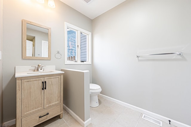 28 W Thompson Ave, Pleasantville, NJ 08232 - bathroom featuring toilet, vanity, tile patterned flooring, baseboards, and visible vents