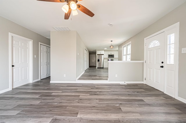 28 W Thompson Ave, Pleasantville, NJ 08232 - foyer entrance featuring wood finished floors, visible vents, baseboards, and ceiling fan