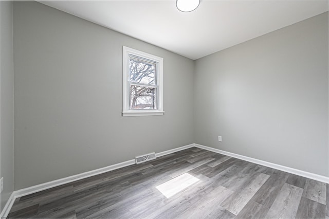 28 W Thompson Ave, Pleasantville, NJ 08232 - empty room featuring baseboards, visible vents, and dark wood finished floors