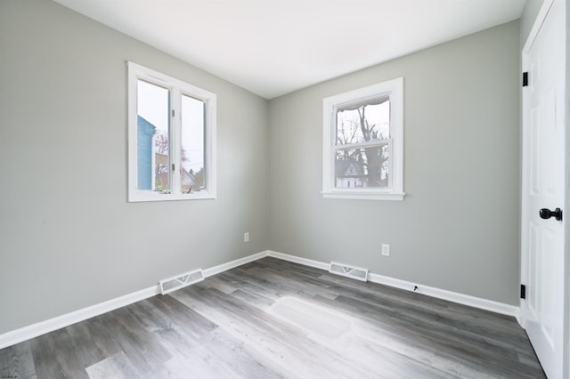 28 W Thompson Ave, Pleasantville, NJ 08232 - unfurnished bedroom featuring dark wood-style flooring, baseboards, and visible vents