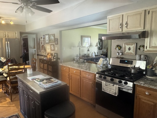 9 Saddle Rdg, Egg Harbor Township, NJ 08234 - kitchen featuring appliances with stainless steel finishes, under cabinet range hood, a ceiling fan, and light stone counters