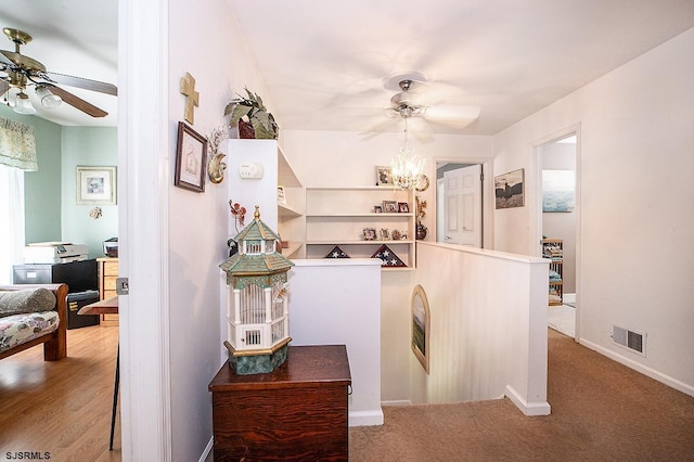 9 Saddle Rdg, Egg Harbor Township, NJ 08234 - corridor featuring baseboards, a chandelier, an upstairs landing, and carpet floors