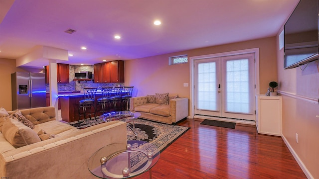 living room with dark wood-style floors, visible vents, french doors, and recessed lighting