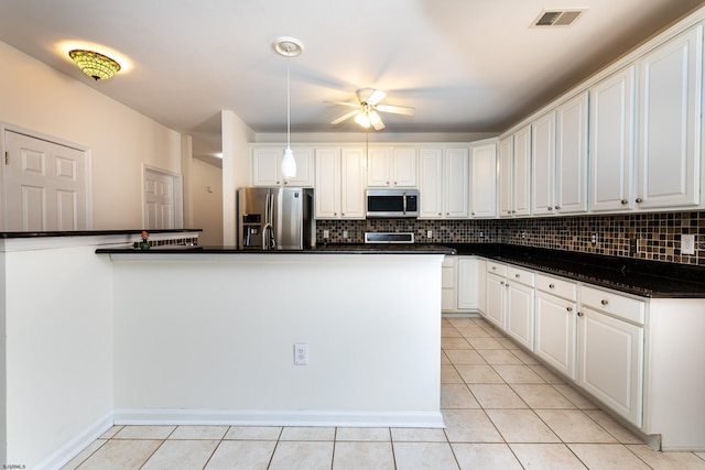 kitchen with visible vents, ceiling fan, dark countertops, stainless steel appliances, and light tile patterned flooring