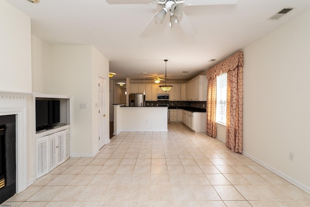 unfurnished living room featuring light tile patterned floors, visible vents, baseboards, and a ceiling fan