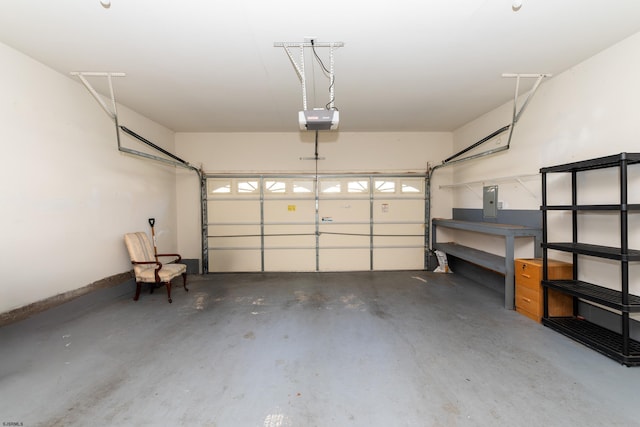 garage with a garage door opener, baseboards, and electric panel