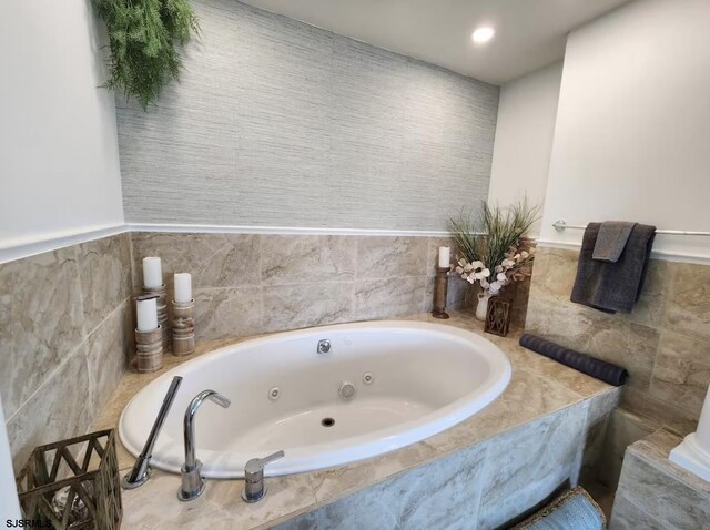 bathroom with a whirlpool tub