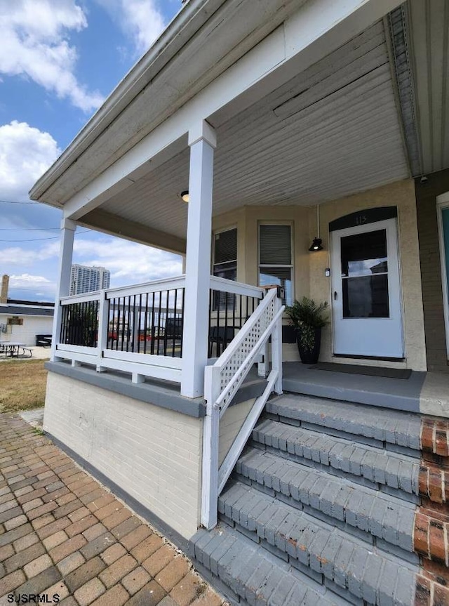 entrance to property with a porch