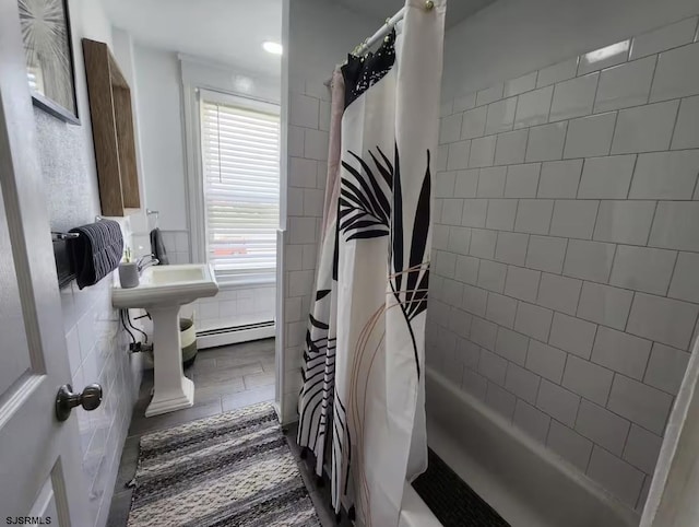full bathroom featuring tile walls, a baseboard radiator, and shower / bathtub combination with curtain