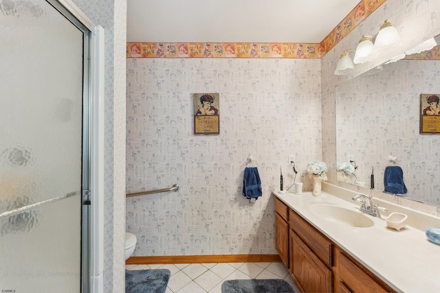 full bath with toilet, a stall shower, baseboards, tile patterned flooring, and vanity