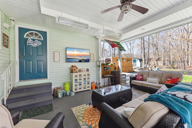 view of patio / terrace featuring ceiling fan, an outdoor living space, and entry steps