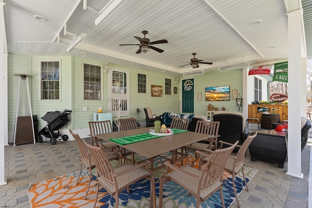 view of patio / terrace featuring ceiling fan, an outdoor hangout area, and outdoor dining space