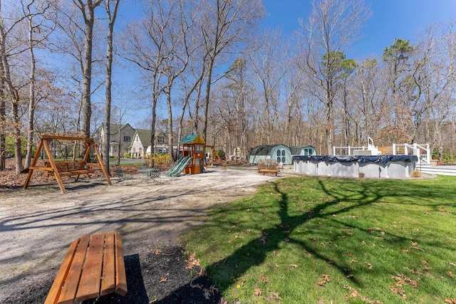 view of playground with a yard