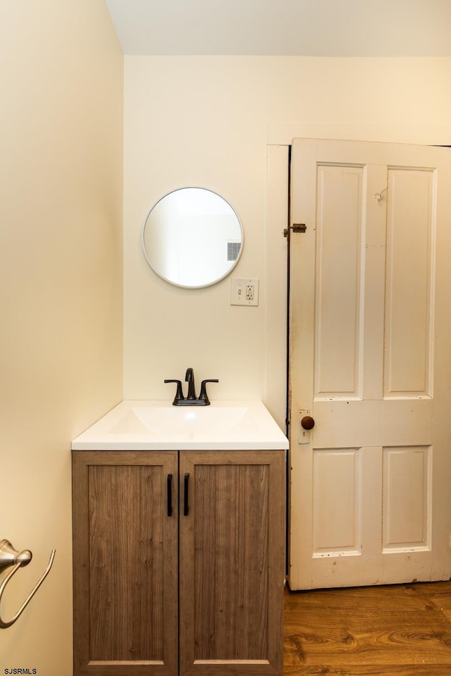 bathroom featuring vanity and wood finished floors