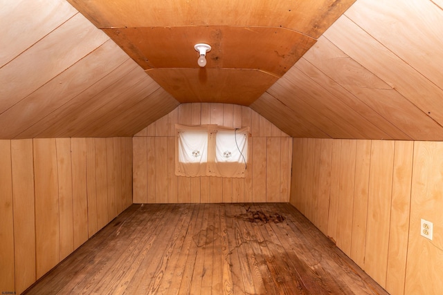 bonus room featuring wood ceiling, wood walls, lofted ceiling, and hardwood / wood-style flooring