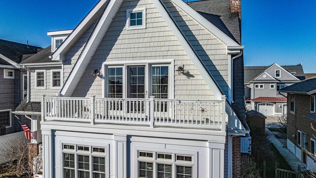22 Spruce Rd, Ocean City, NJ 08226 - back of property with a balcony and a chimney