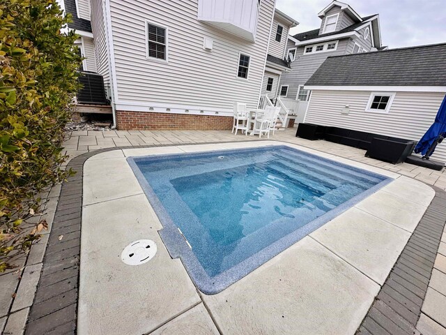 22 Spruce Rd, Ocean City, NJ 08226 - view of pool featuring an outdoor structure, central AC unit, a patio, a storage unit, and a hot tub