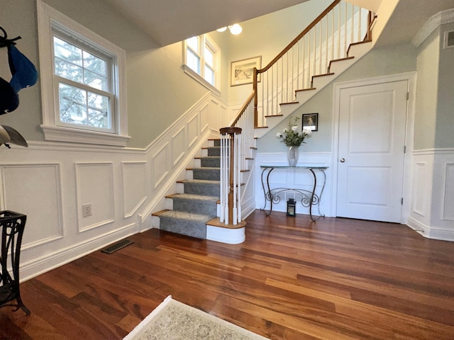 22 Spruce Rd, Ocean City, NJ 08226 - staircase featuring a decorative wall, wood finished floors, and a wainscoted wall
