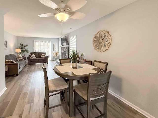 722 Fishers Creek Rd, Galloway Township, NJ 08205 - dining room featuring baseboards, a ceiling fan, and wood finished floors
