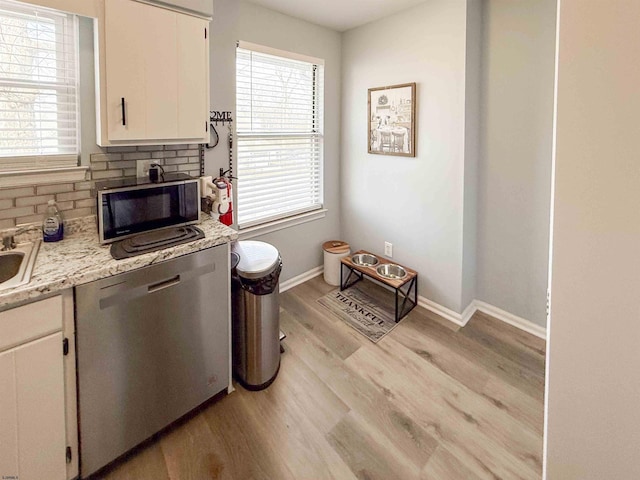 722 Fishers Creek Rd, Galloway Township, NJ 08205 - kitchen featuring baseboards, stainless steel dishwasher, white cabinetry, backsplash, and light wood-style flooring