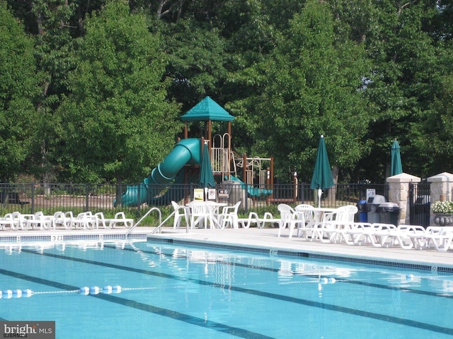 722 Fishers Creek Rd, Galloway Township, NJ 08205 - pool with a water slide, fence, and playground community