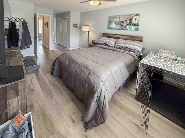 722 Fishers Creek Rd, Galloway Township, NJ 08205 - bedroom with a closet, light wood finished floors, ceiling fan, and baseboards