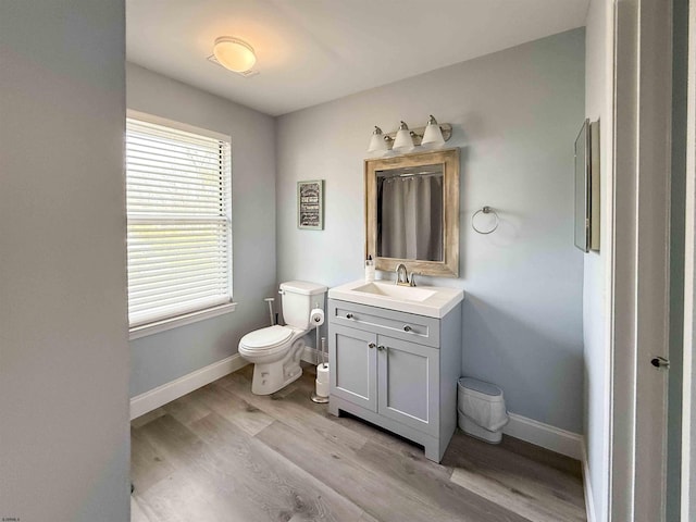 722 Fishers Creek Rd, Galloway Township, NJ 08205 - bathroom featuring toilet, wood finished floors, vanity, and baseboards