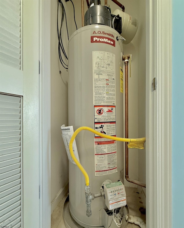 utility room featuring gas water heater