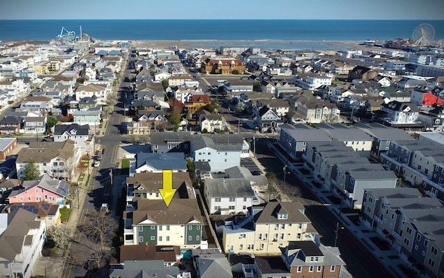 bird's eye view featuring a water view and a residential view