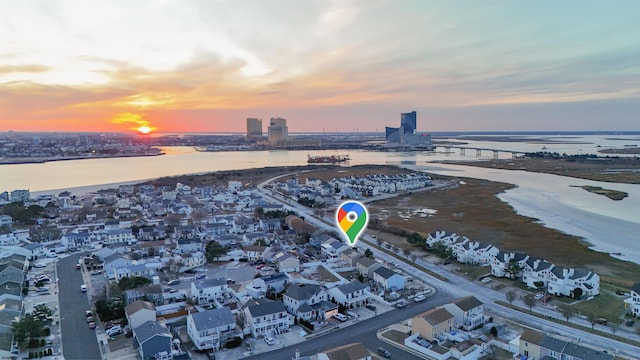 aerial view at dusk with a water view