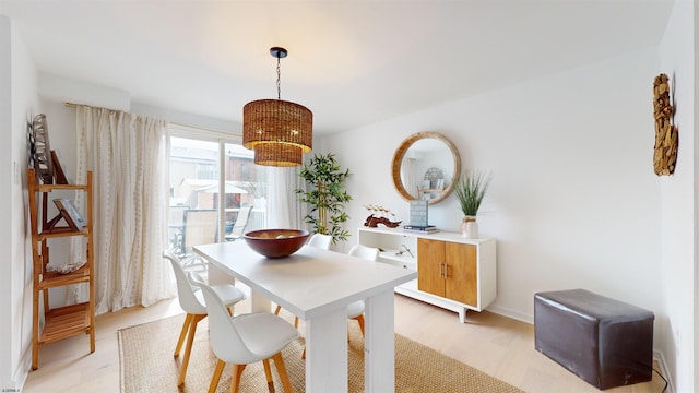 dining area with light wood-type flooring