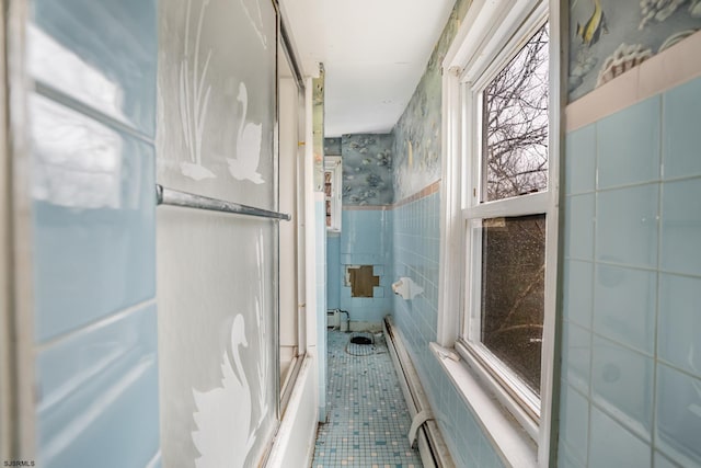 611-615 S New York Rd, Galloway Township, NJ 08205 - full bathroom with tile walls, tile patterned flooring, healthy amount of natural light, and combined bath / shower with glass door