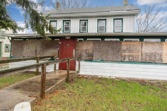 611-615 S New York Rd, Galloway Township, NJ 08205 - view of front facade featuring a chimney, roof with shingles, and board and batten siding