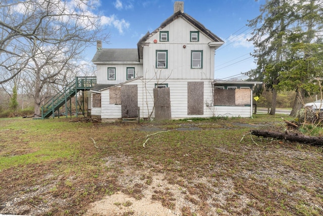 611-615 S New York Rd, Galloway Township, NJ 08205 - back of house featuring a chimney, stairway, board and batten siding, and a yard