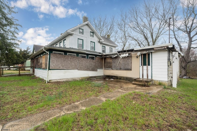 611-615 S New York Rd, Galloway Township, NJ 08205 - back of property with a chimney and a sunroom