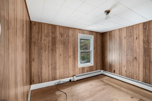 611-615 S New York Rd, Galloway Township, NJ 08205 - spare room with a baseboard heating unit and wooden walls