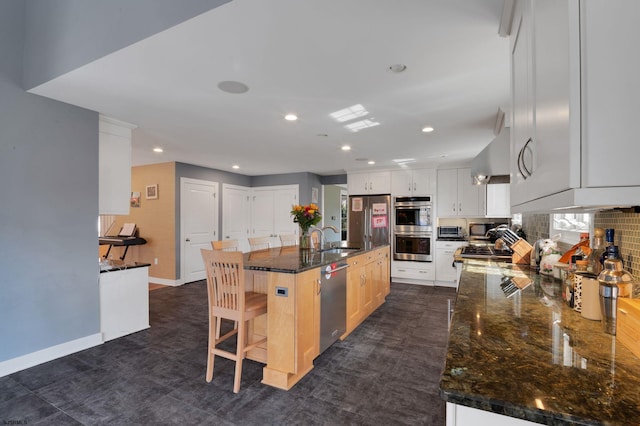 209 Belhaven Ave, Linwood, NJ 08221 - kitchen with appliances with stainless steel finishes, wall chimney exhaust hood, decorative backsplash, recessed lighting, and a breakfast bar
