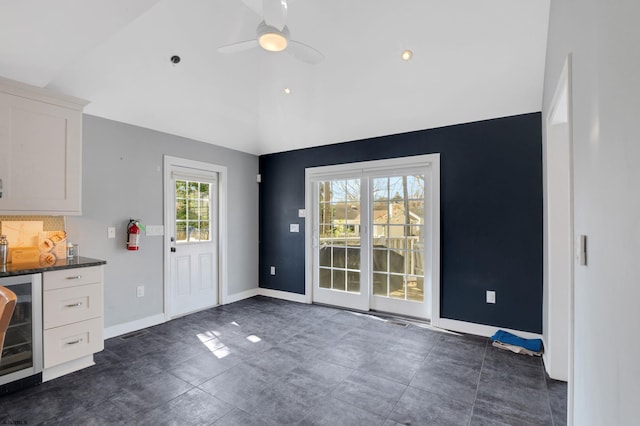 209 Belhaven Ave, Linwood, NJ 08221 - kitchen with vaulted ceiling, beverage cooler, white cabinetry, and ceiling fan