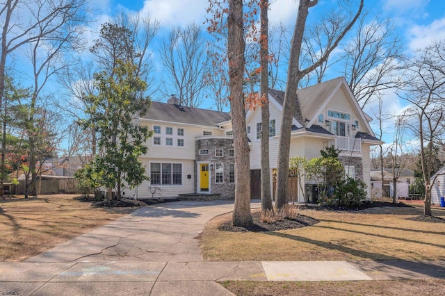 209 Belhaven Ave, Linwood, NJ 08221 - view of front of house with driveway, a chimney, and stone siding