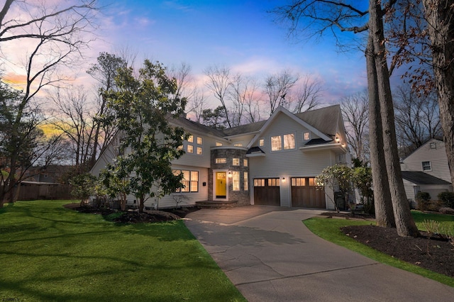 209 Belhaven Ave, Linwood, NJ 08221 - view of front of home featuring a garage, concrete driveway, a front lawn, and stone siding
