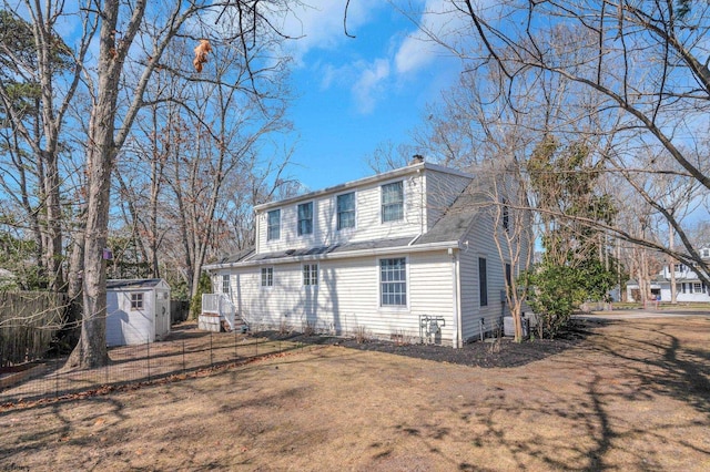 209 Belhaven Ave, Linwood, NJ 08221 - rear view of house featuring a storage shed and a chimney